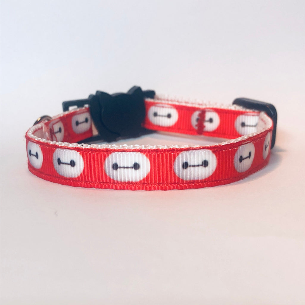 Red collar with white face design on a light gray background