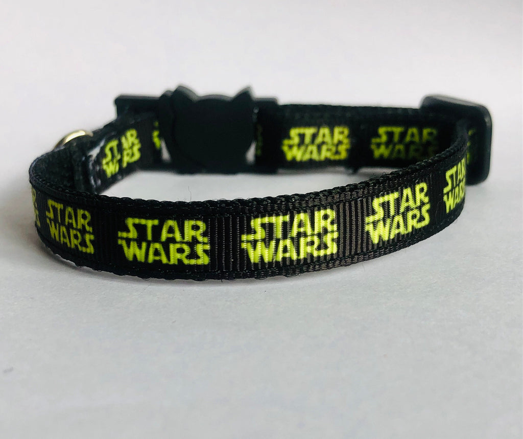 Black cat collar with 'Star Wars' text on a white background