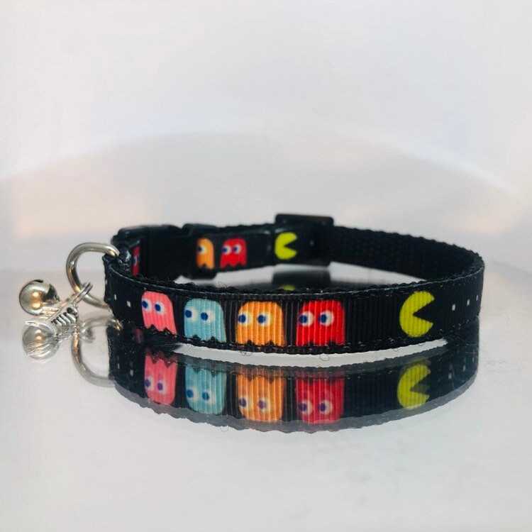 Cat collar with colorful Pac-Man ghost design on a white background