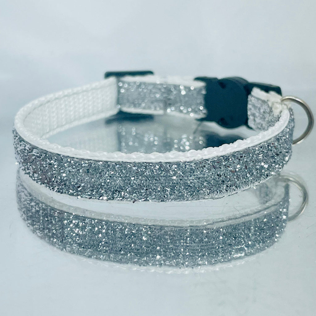 Silver glittery collar on a light gray background